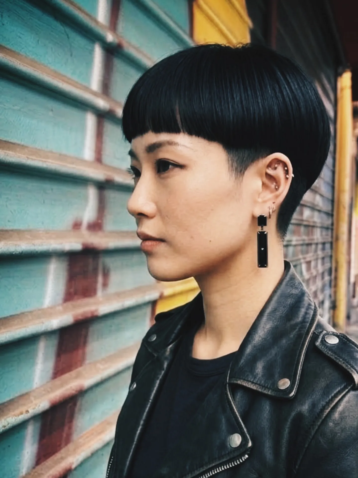 Black tapered bowl cut with short fringe