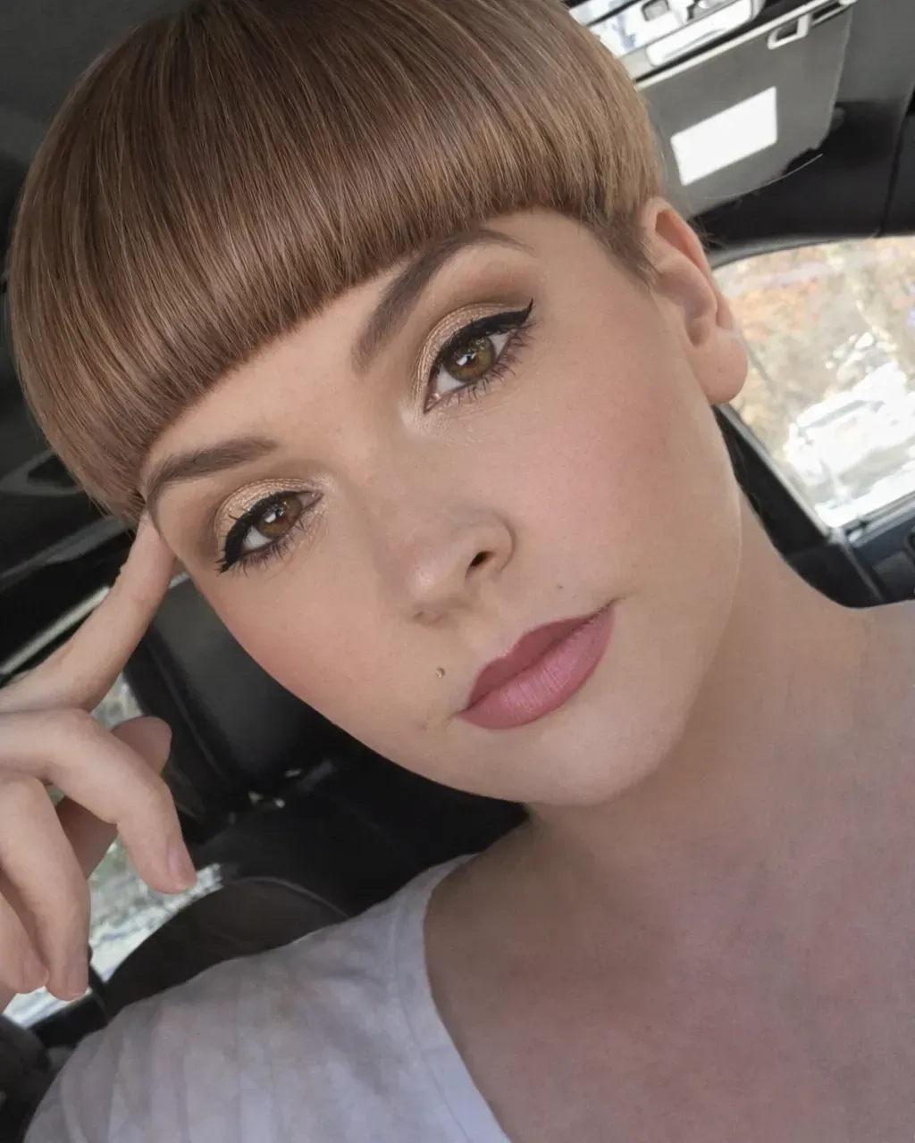 Brown bowl cut with softly side swept fringe