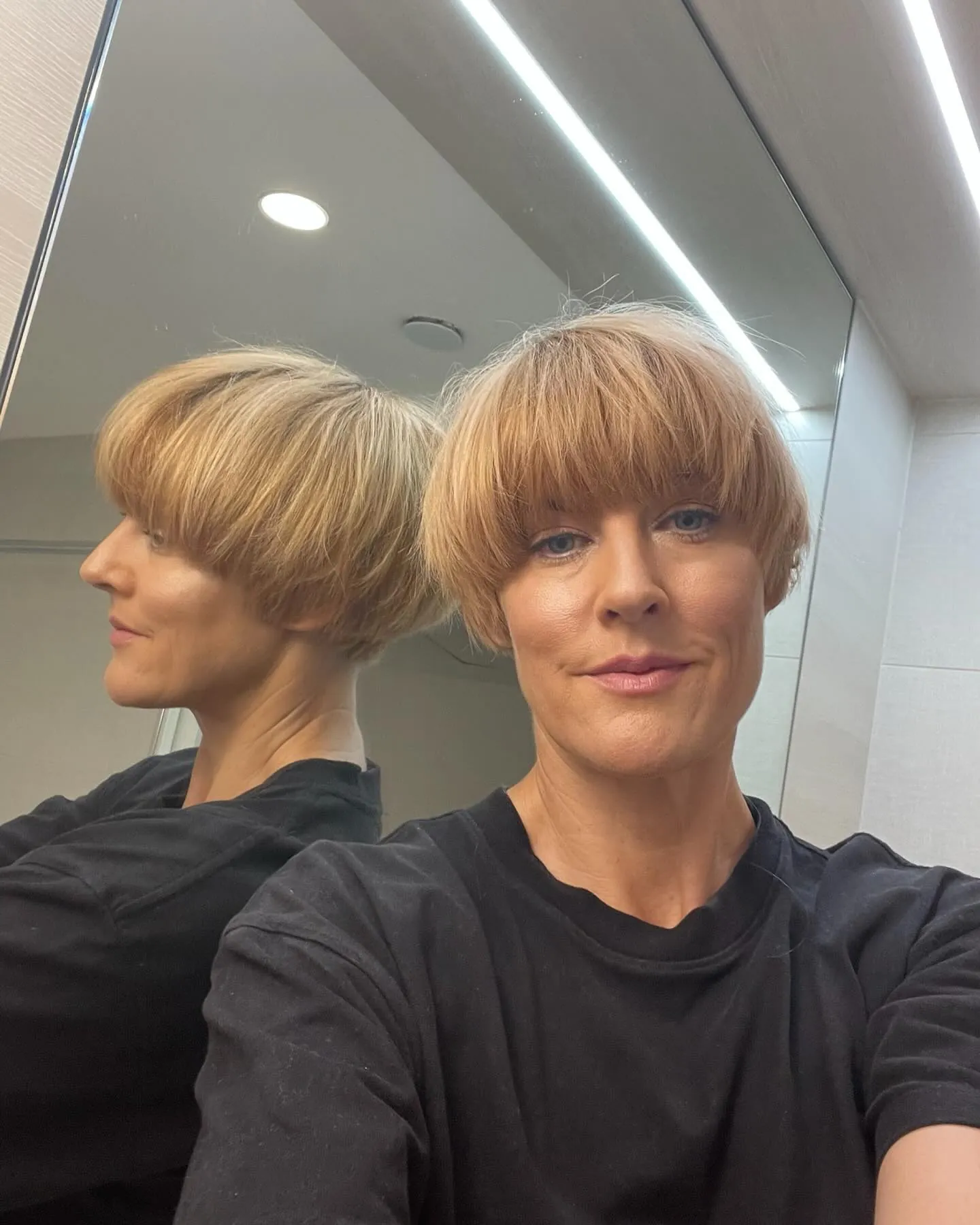 Soft blonde rounded bowl cut with wispy finish