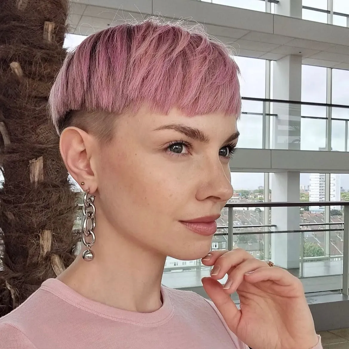 Textured pink bowl cut with closely cropped sides