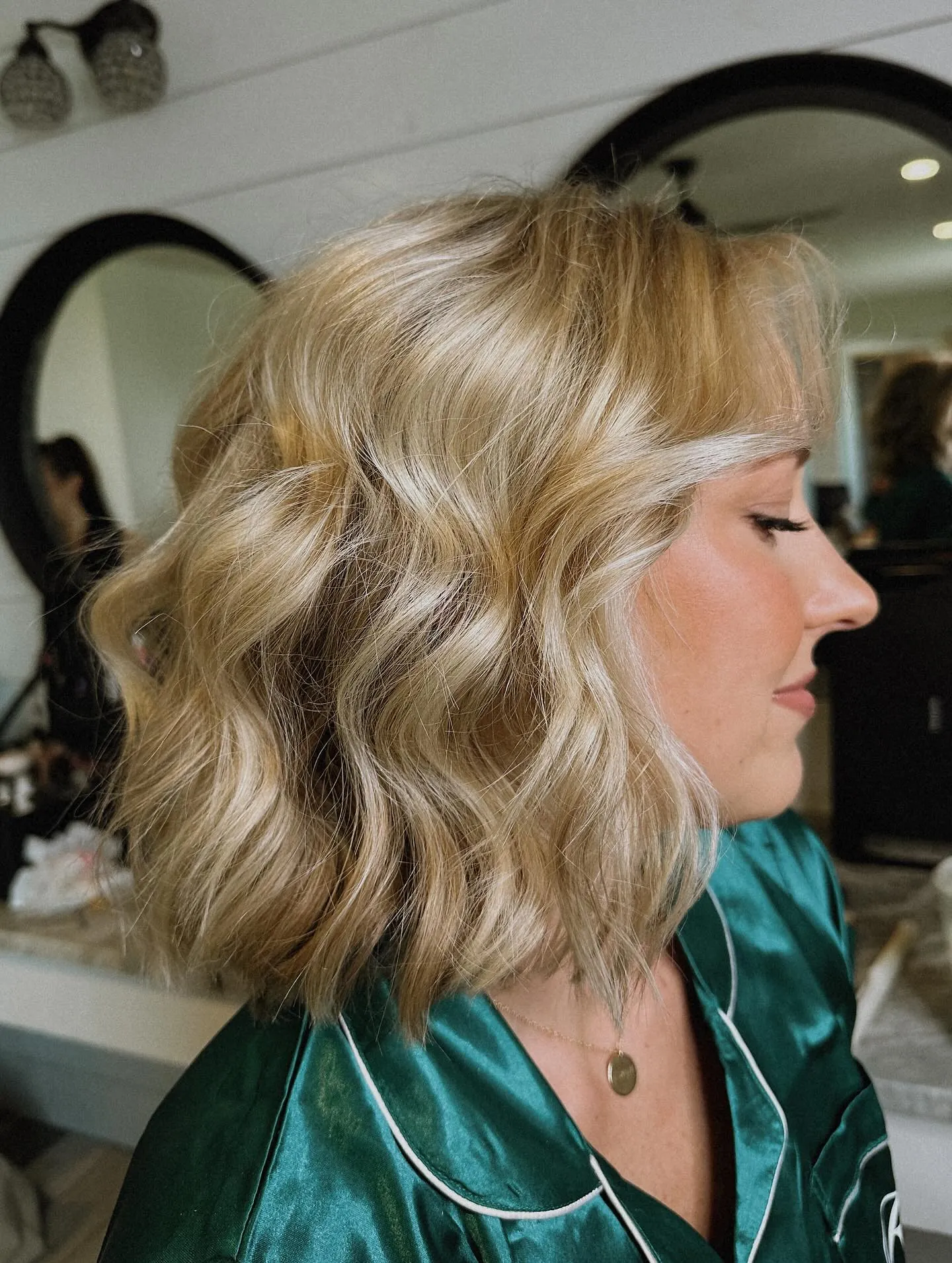 Blonde wavy bob with a side-swept front