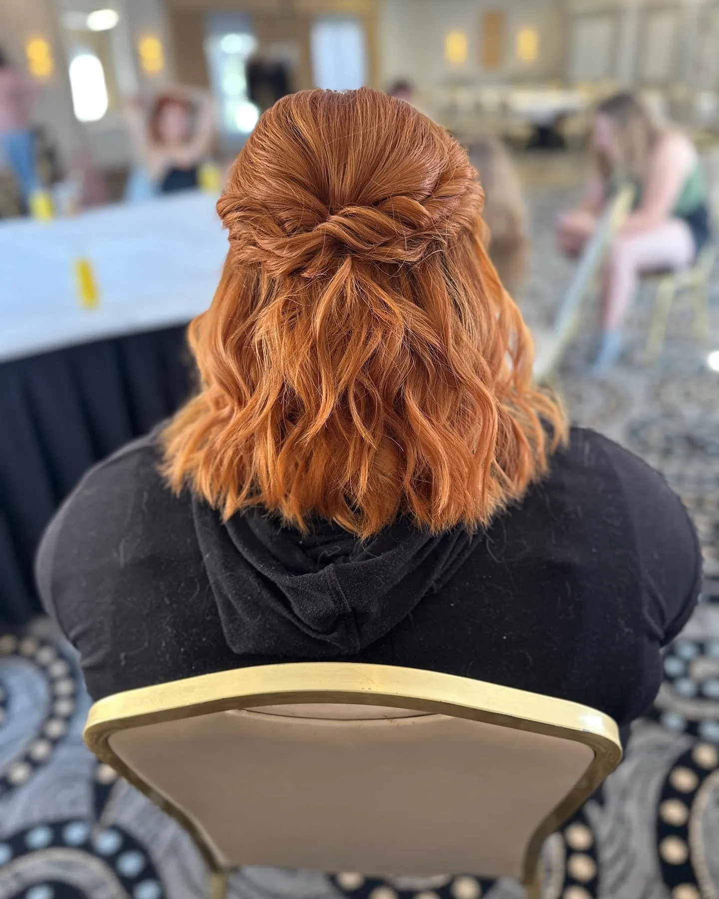 Copper wavy bob with a twisted half-up back