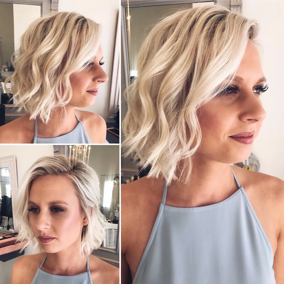 Blonde short wavy bob with a deep side part