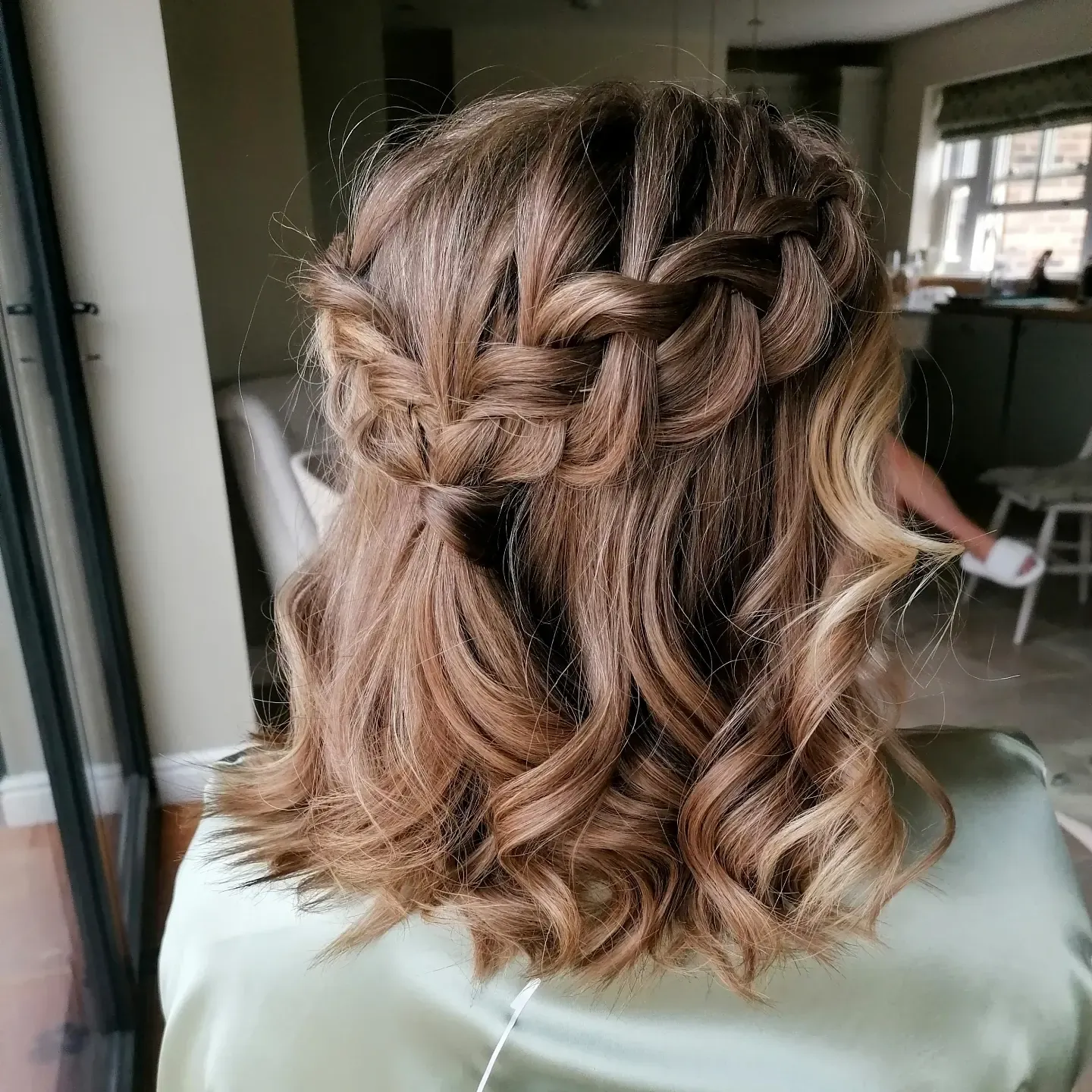 Short curled bob with a braided half-up style