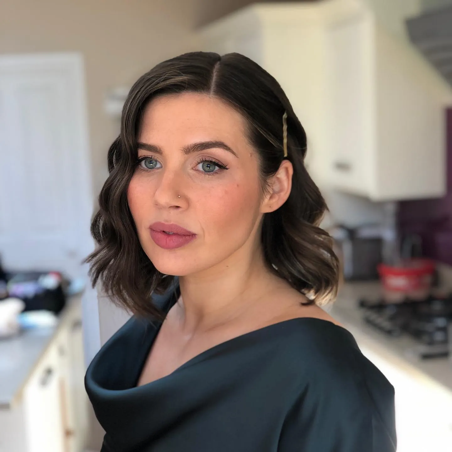 Dark wavy bob with a small side hair clip