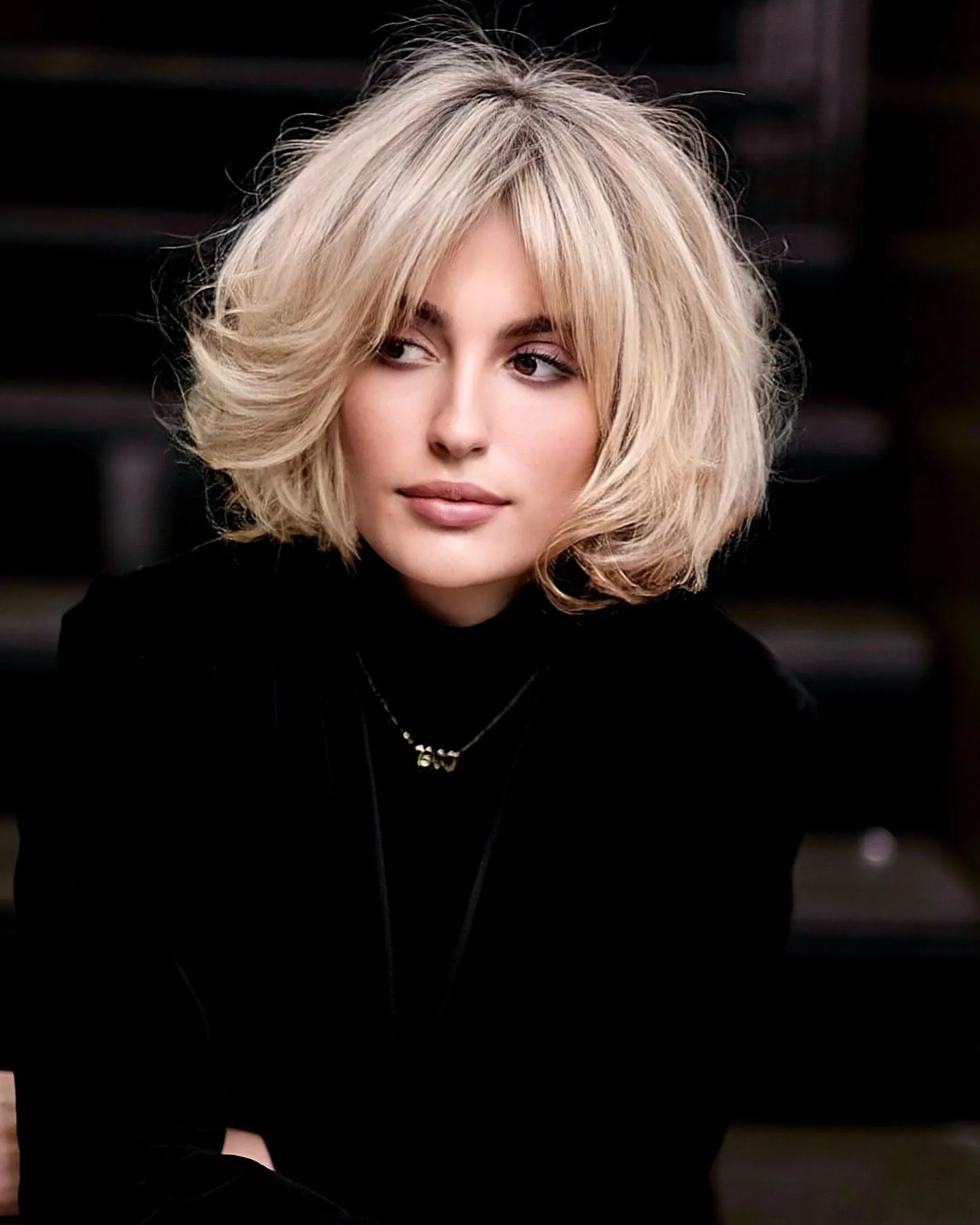Voluminous blonde bubble bob with feathered rounded layers
