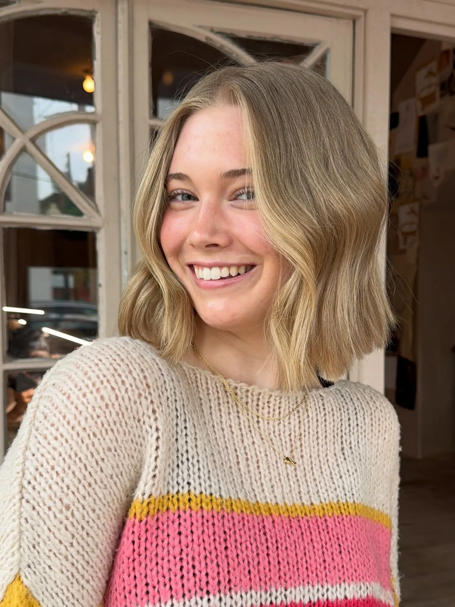 Wavy blonde bubble bob with soft shoulder-skimming ends