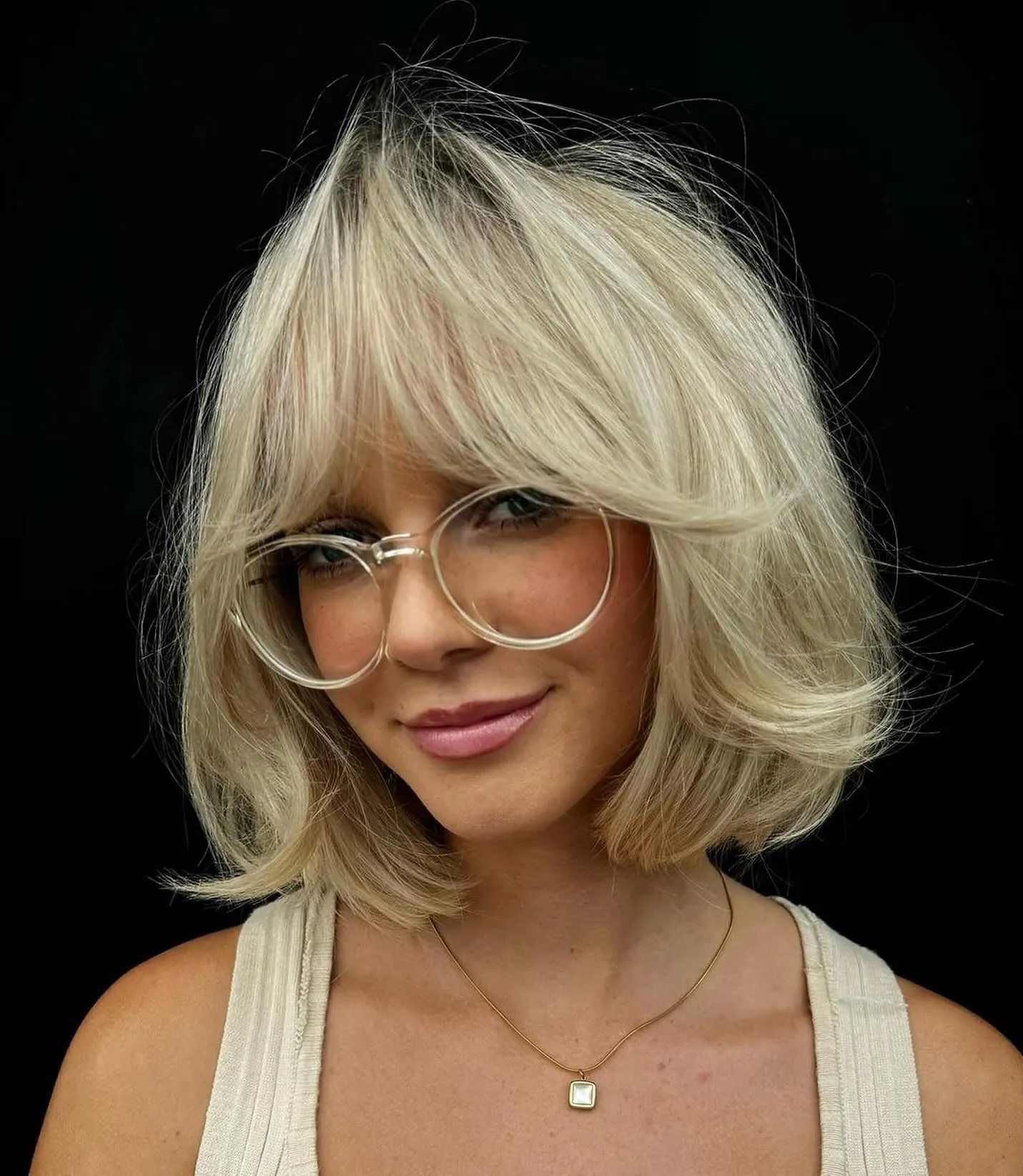 Blonde feathered bubble bob with curtain fringe and curved layers