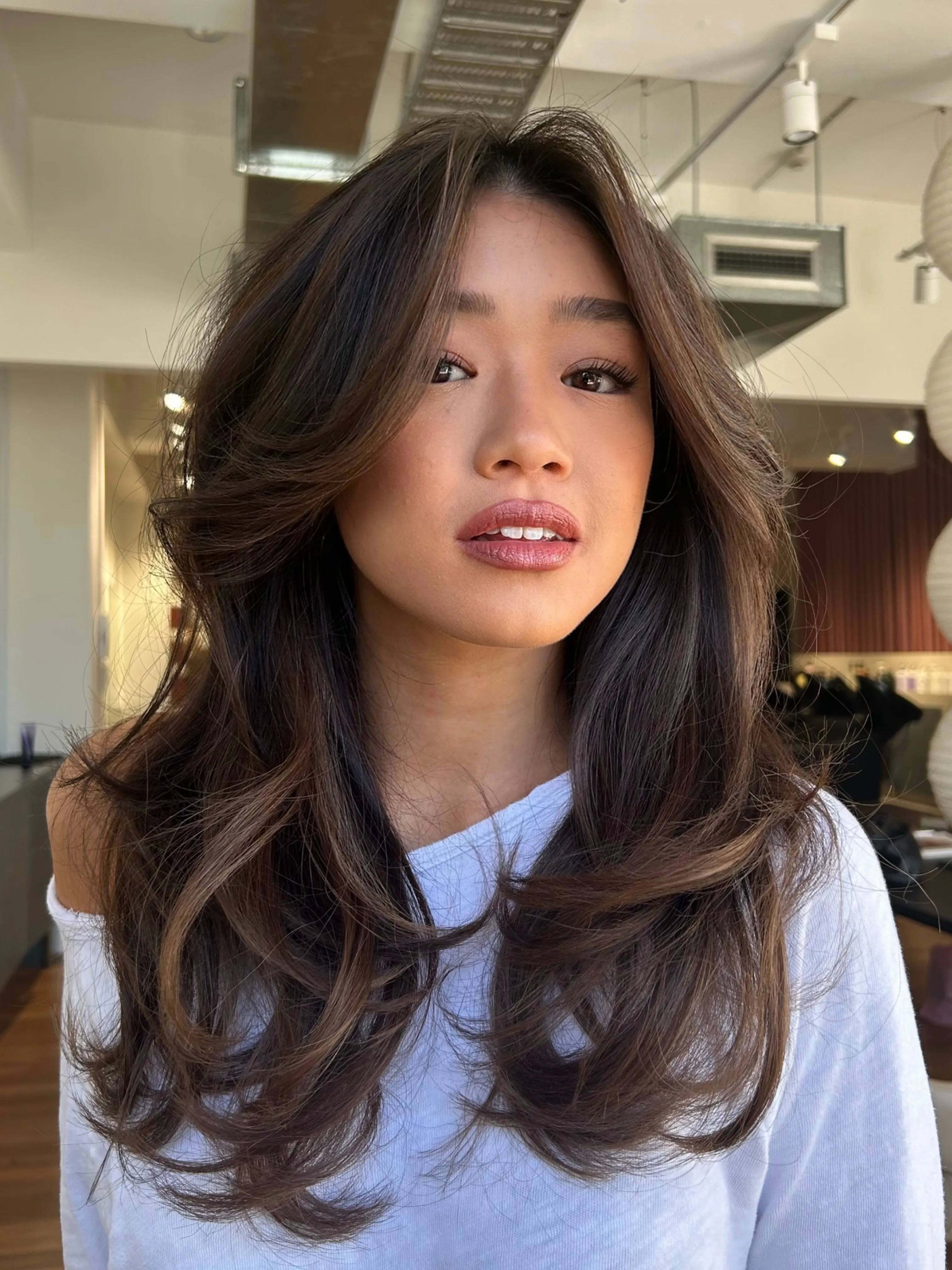 Charcoal brunette butterfly cut with lifted face-framing layers