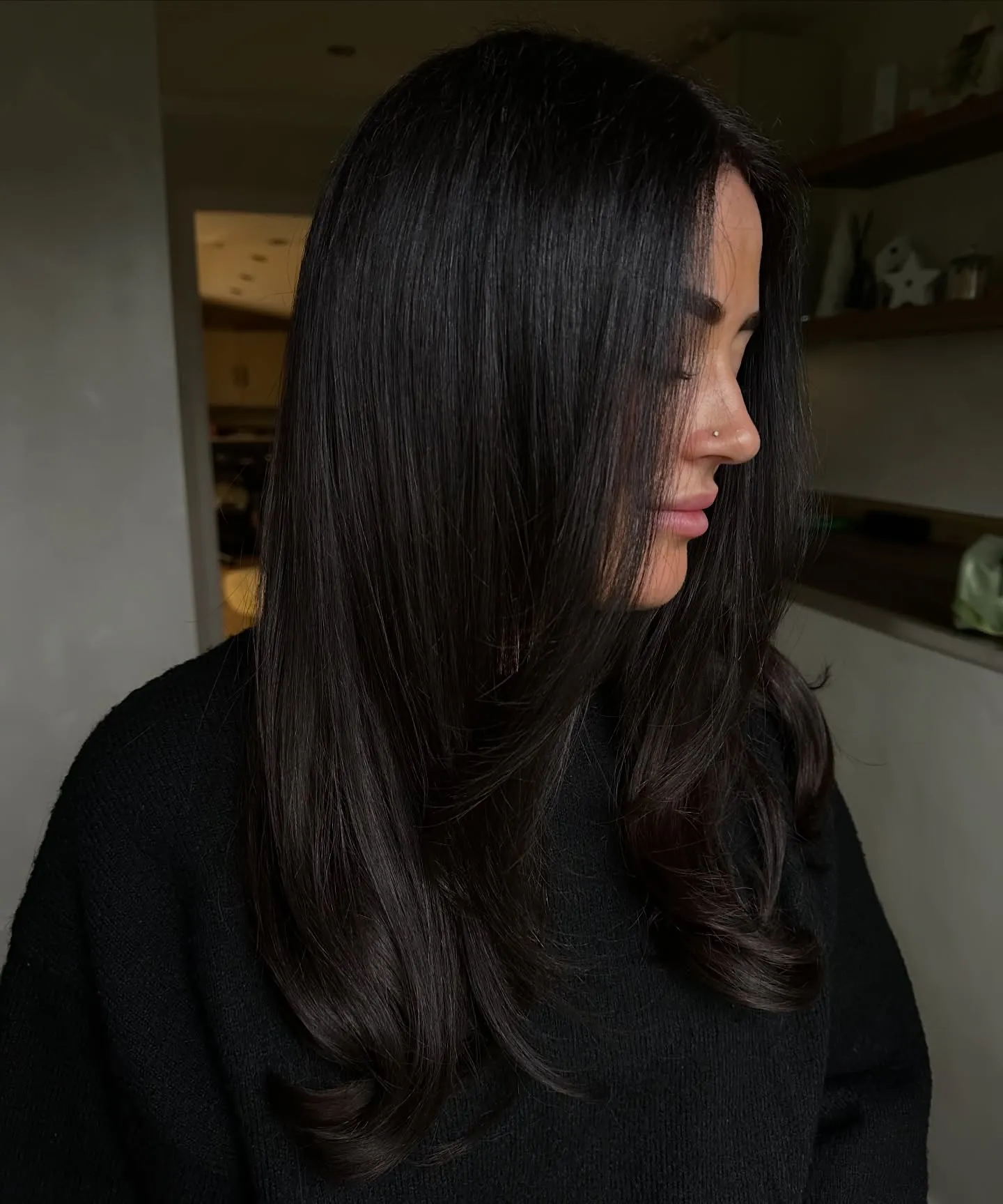 Long sleek charcoal brunette hair with smooth face-framing layers