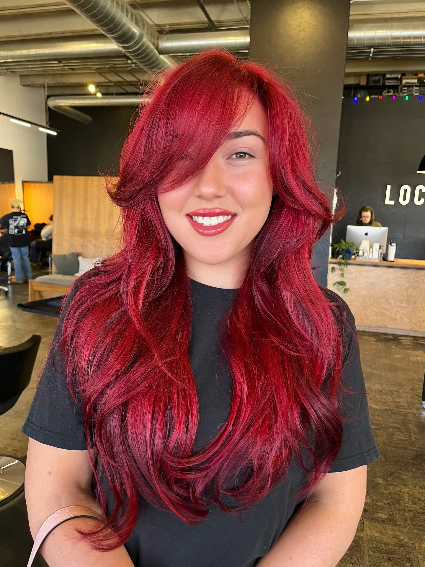 cherry red hair with side-swept long layers
