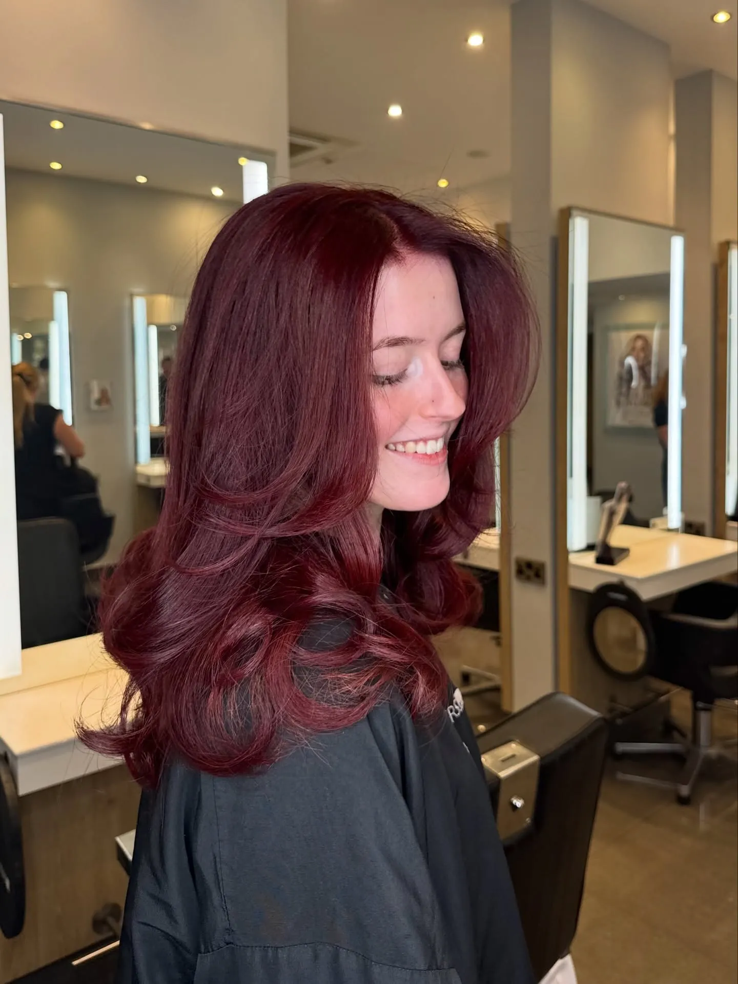 cherry red hair with layered blowout waves