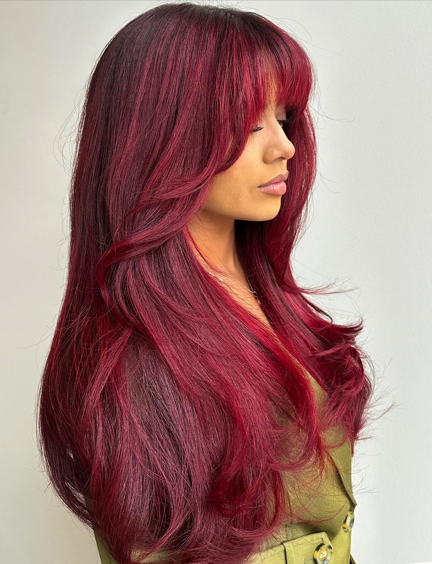 cherry red hair with full fringe blowout