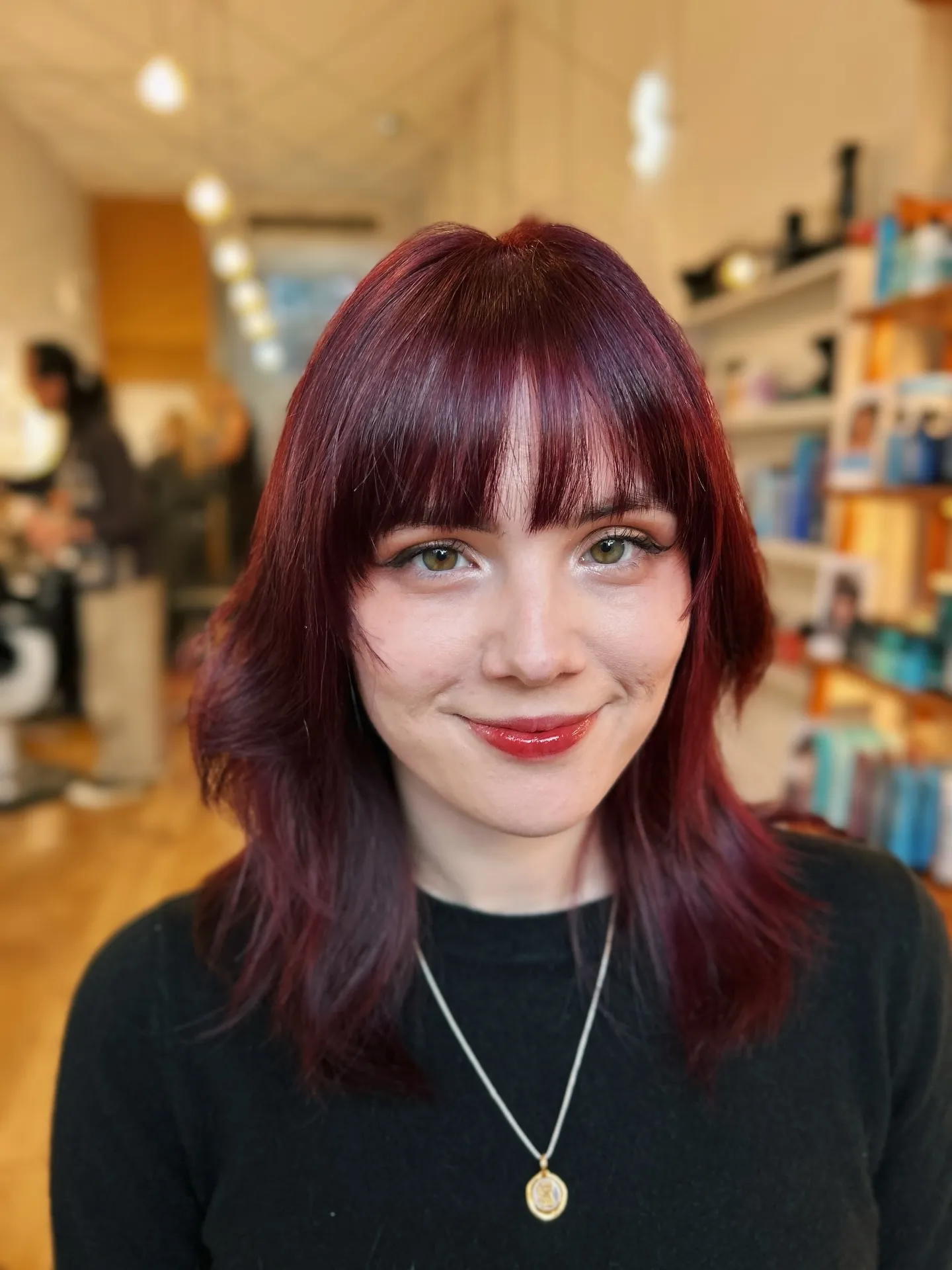 cherry red hair with blunt fringe shag
