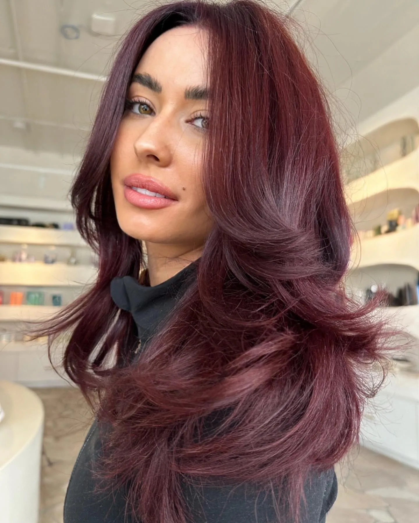 cherry red hair with feathered shoulder layers
