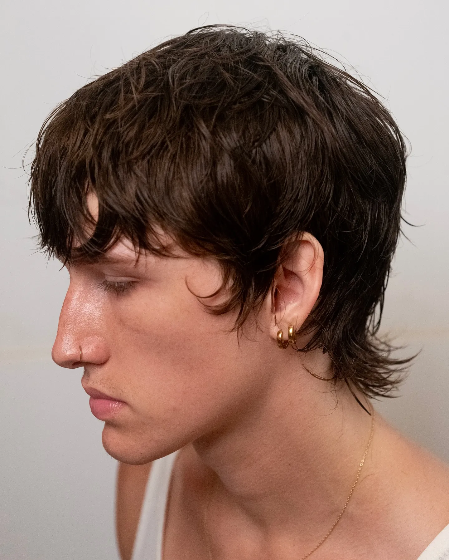 Short dark chillet with wet look fringe and longer nape
