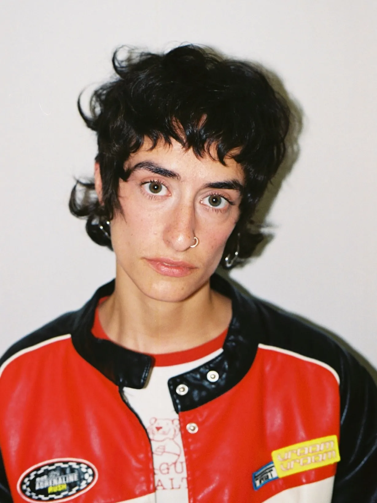 Curly black chillet with short fringe and soft nape