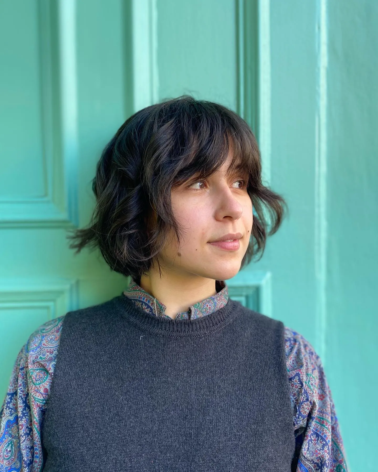 Dark soft bob chillet with wispy longer nape