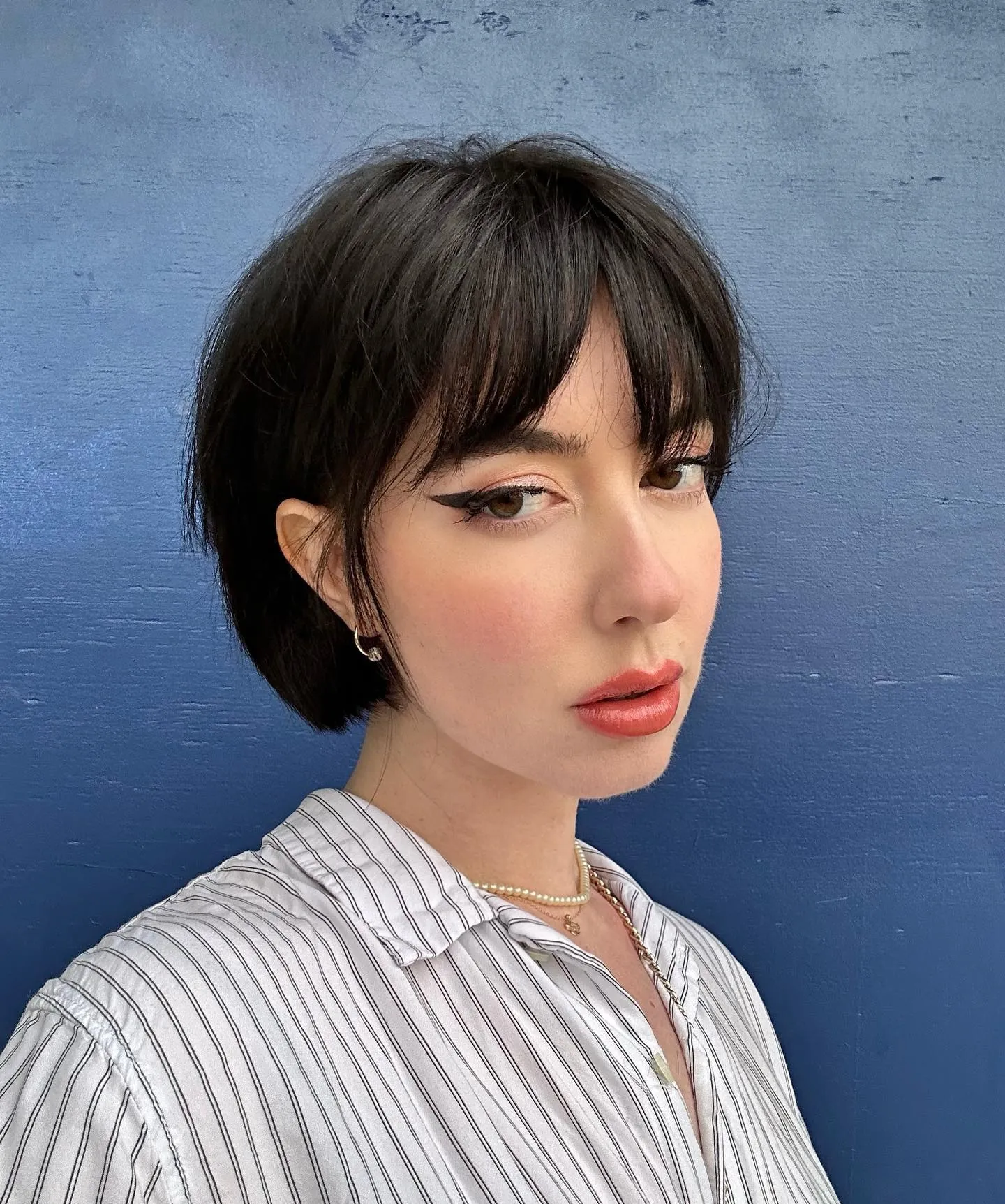 Short dark chillet with blunt micro bob fringe
