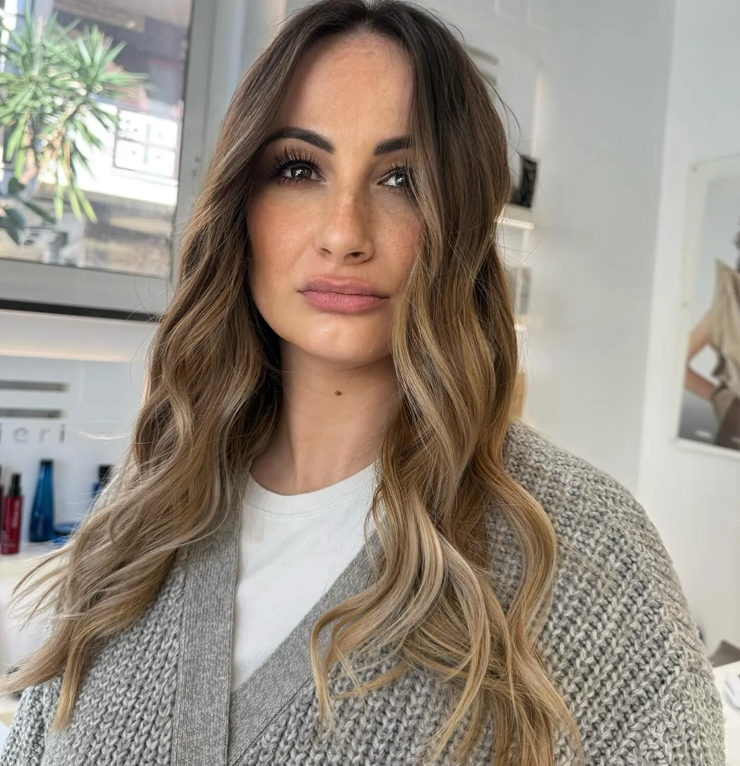 Long brunette waves with soft beige blonde balayage
