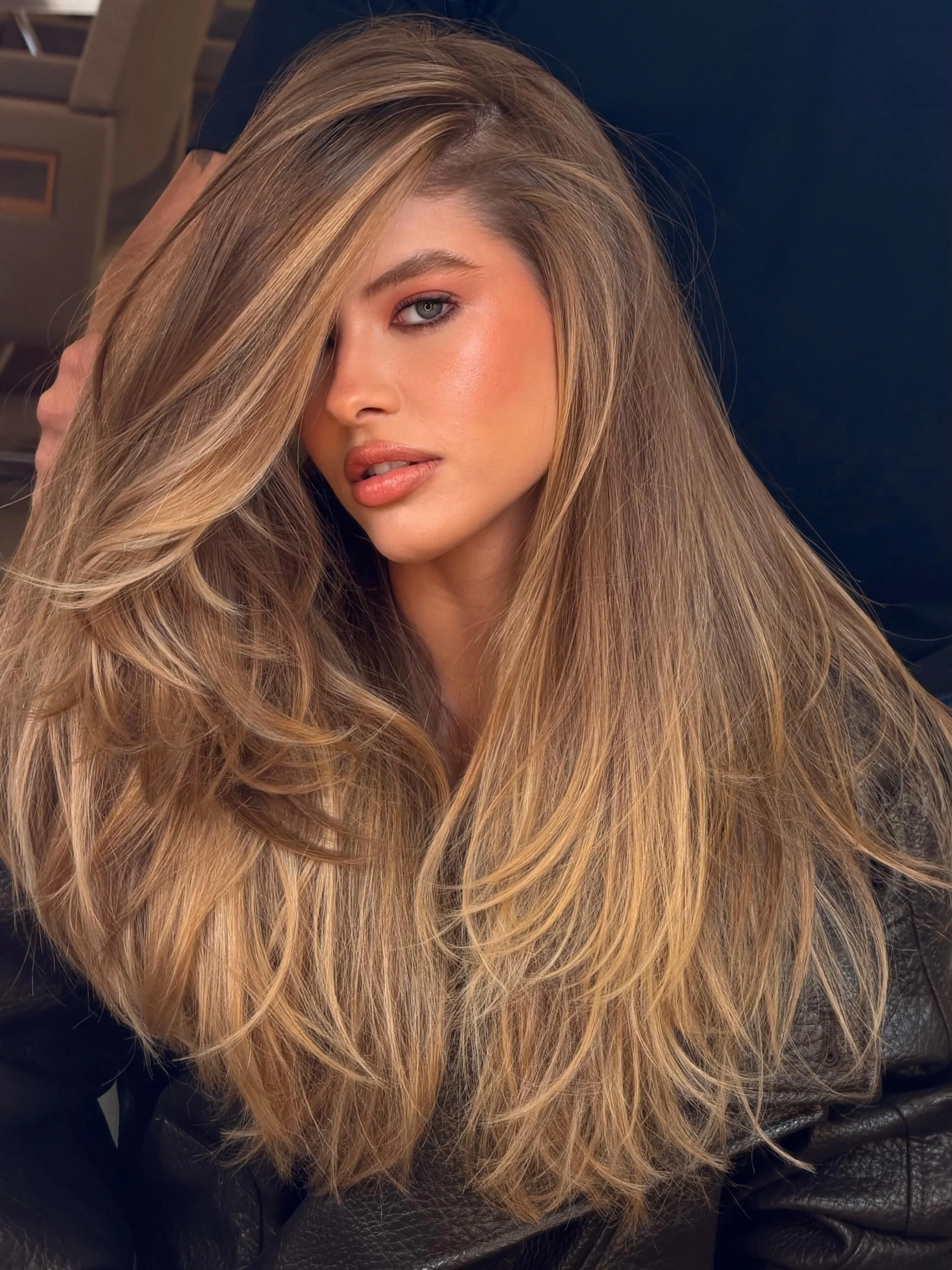 Long soft brown layers with blended blonde highlights
