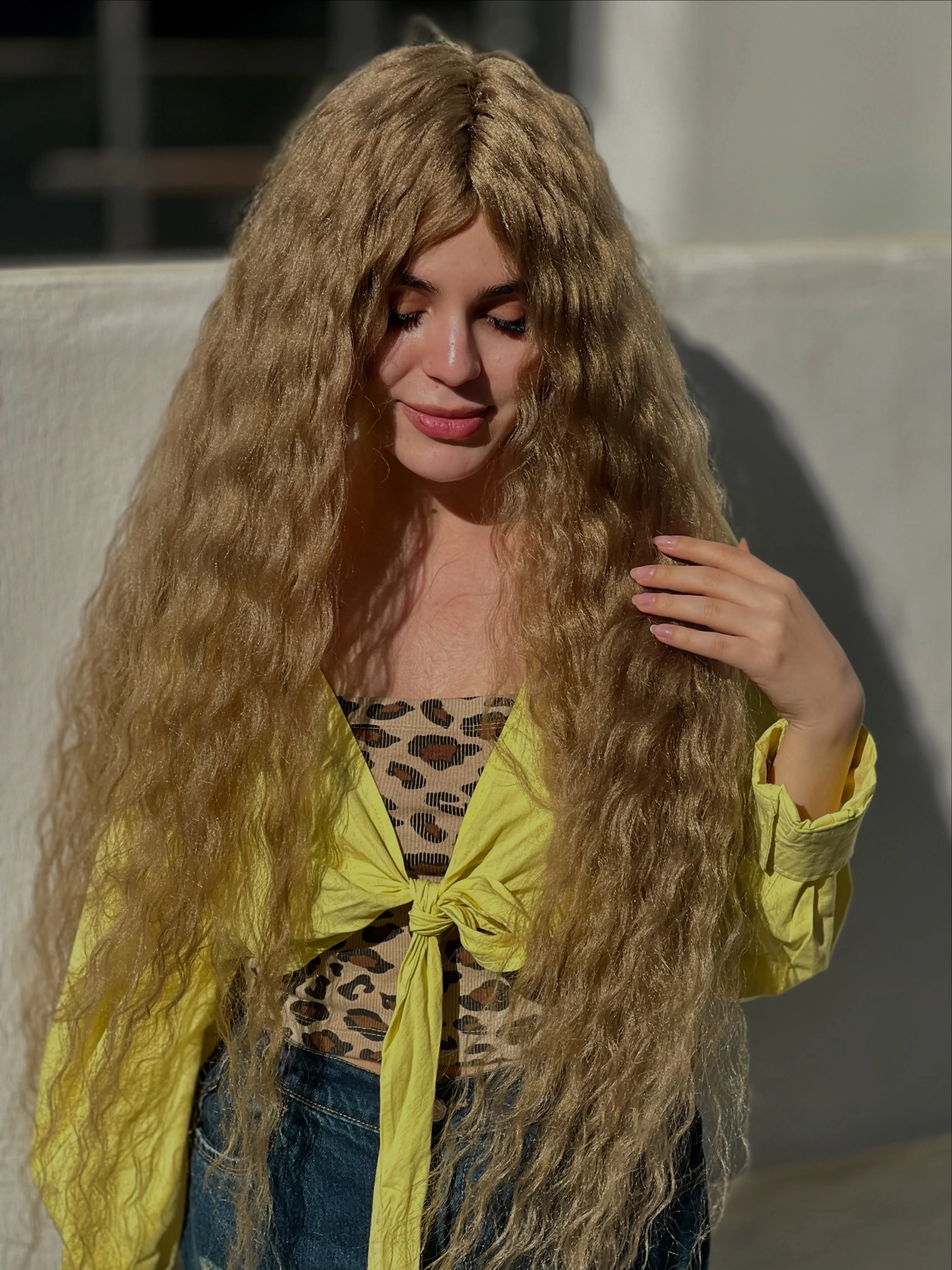 Very long blonde hair with fine all over crimping