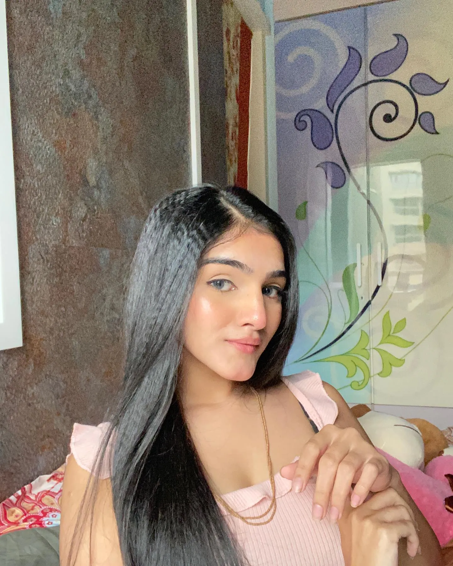 Long straight black hair with subtle crimped accent section