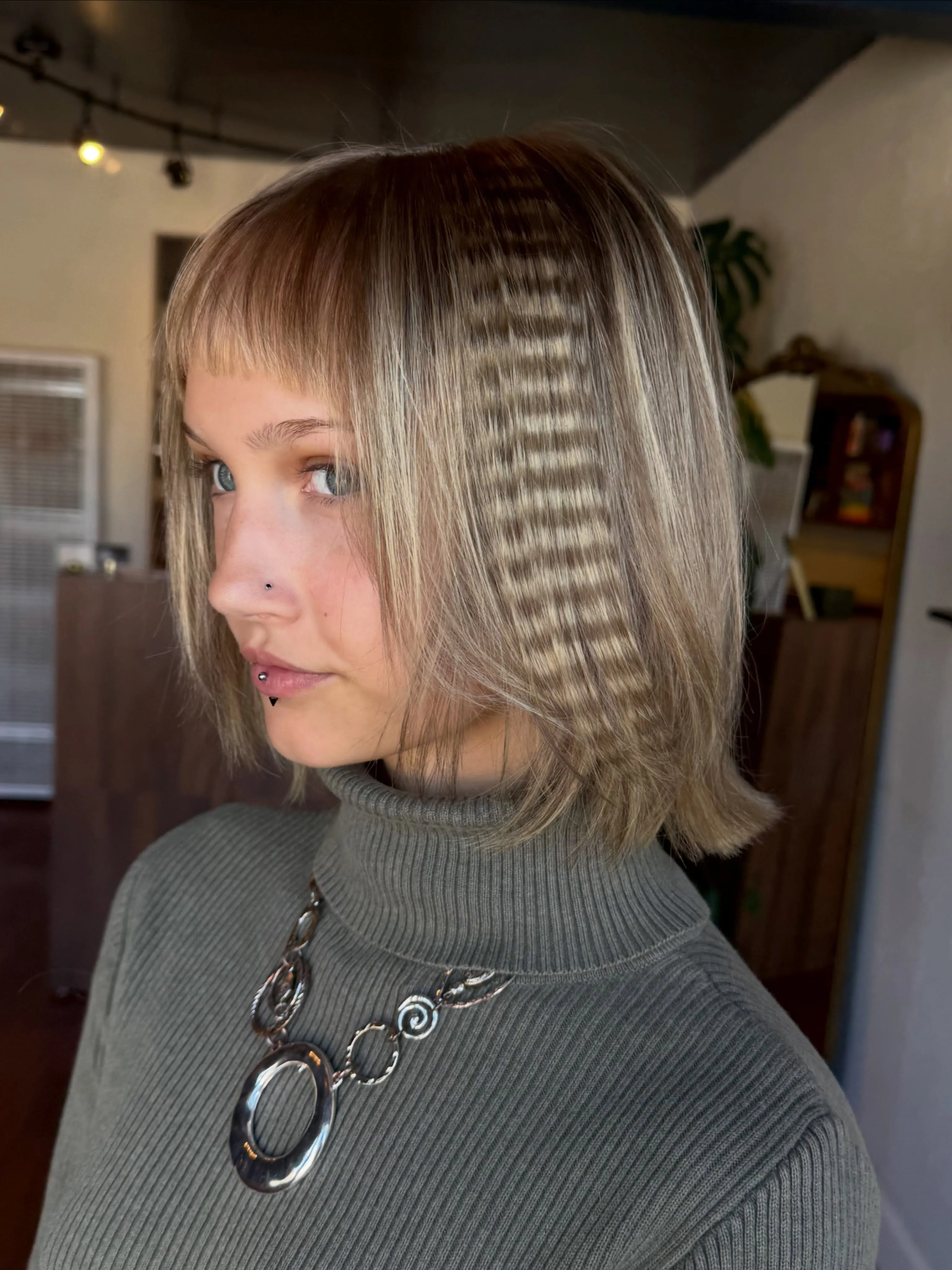 Blunt bob with one strongly crimped side panel