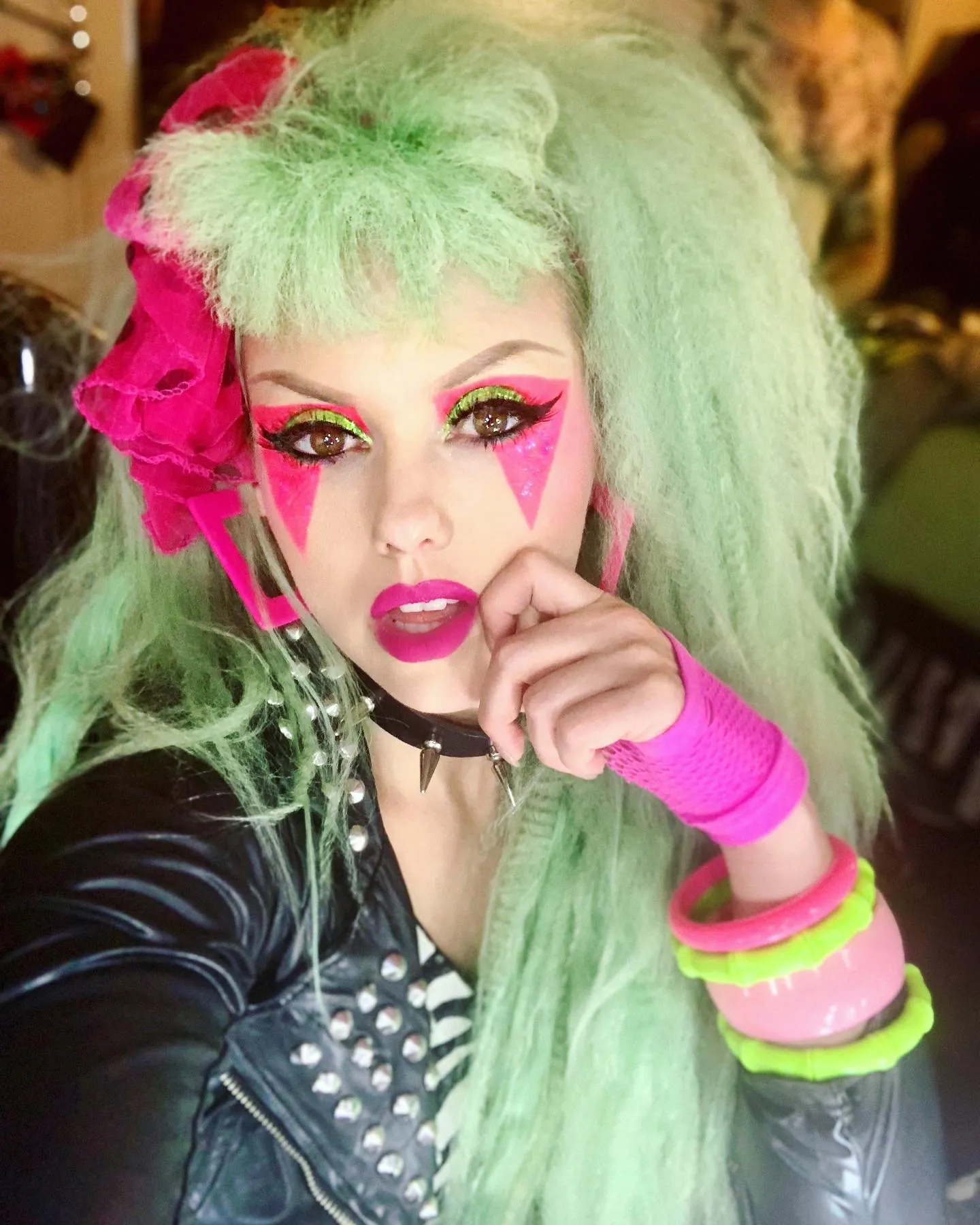 Pastel green hair with large crimped volume