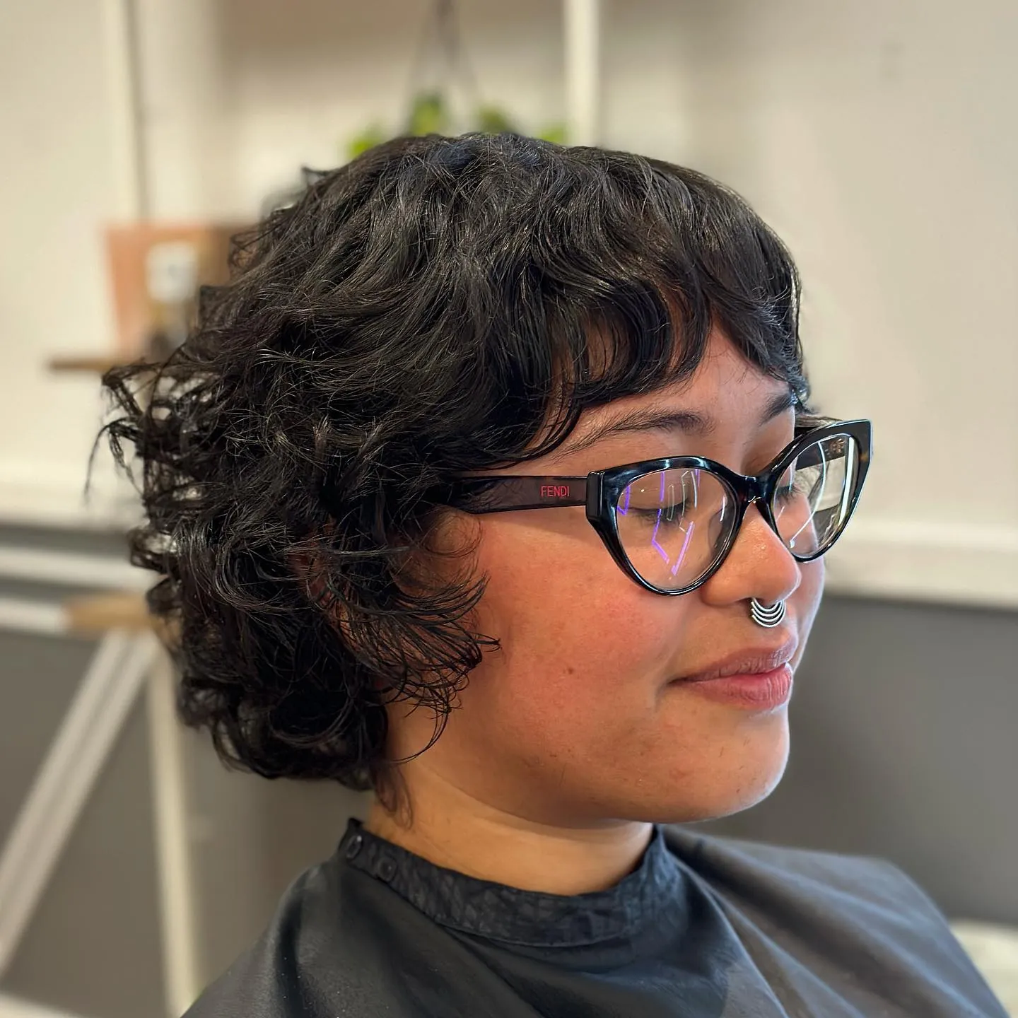 Rounded wavy bixie with soft fringe and fuller sides