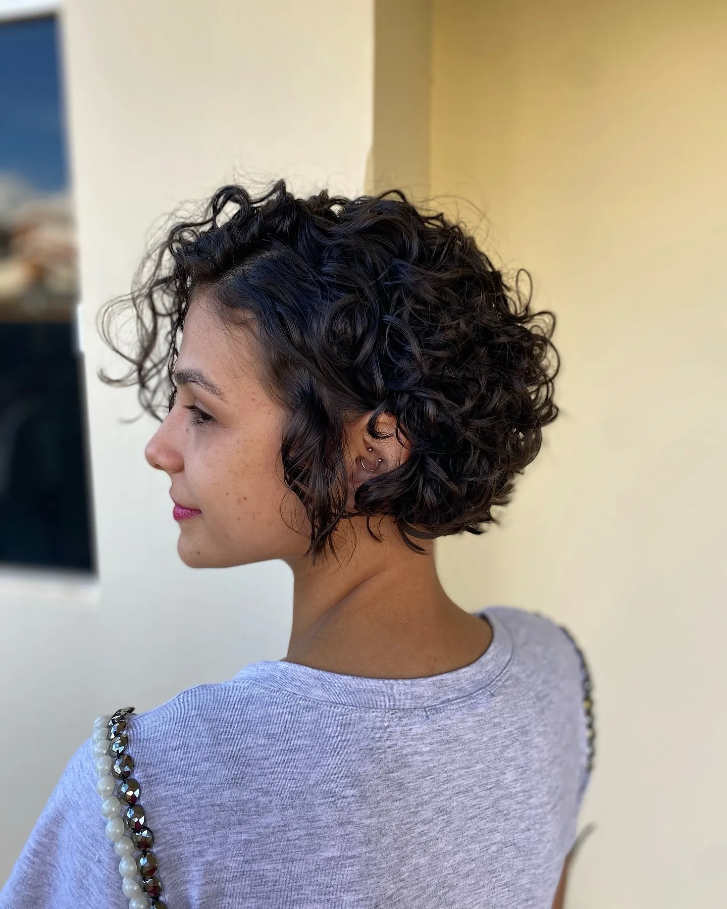 Tapered curl bixie with short nape and defined side curls
