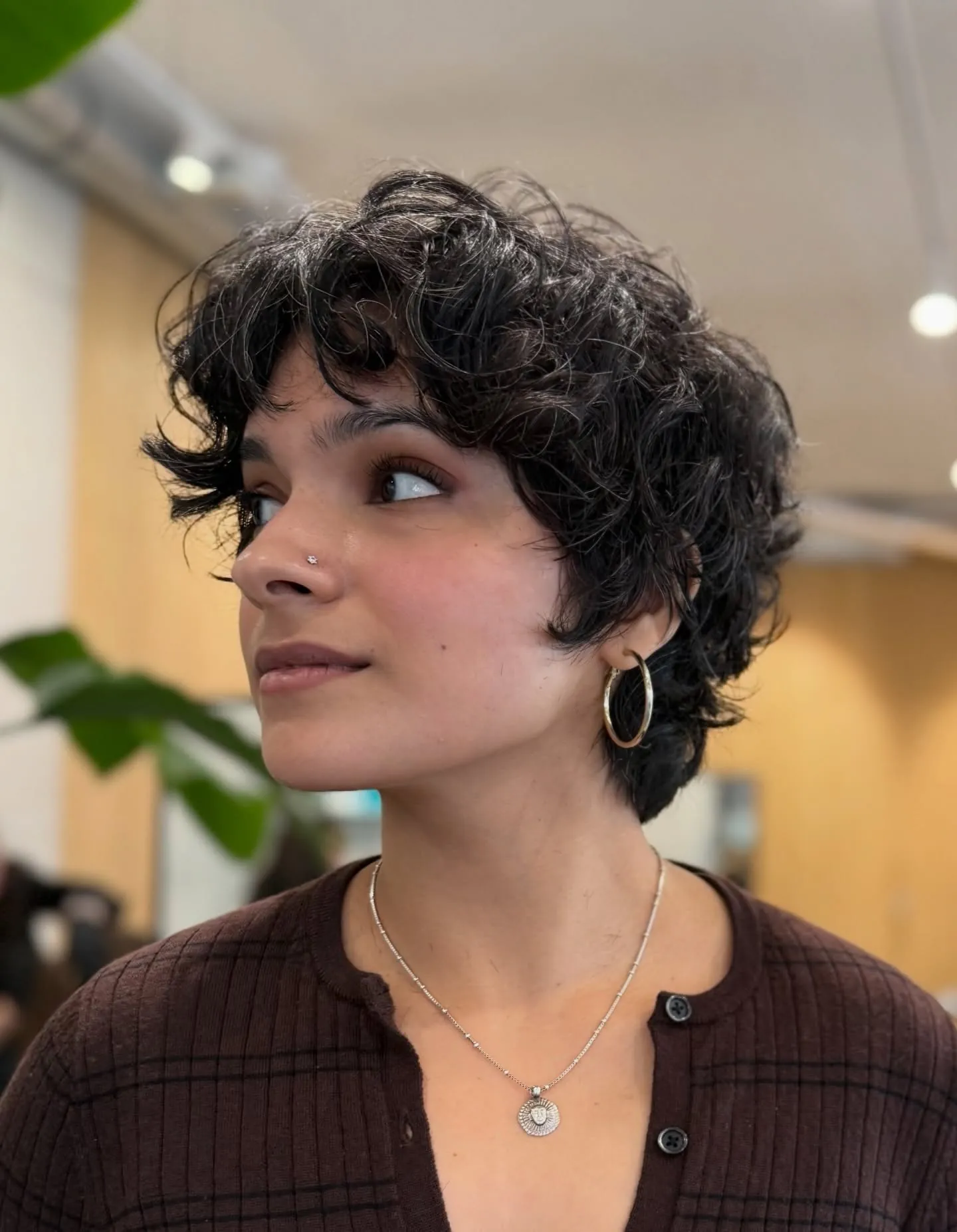 Wispy curly bixie with airy texture and short fringe