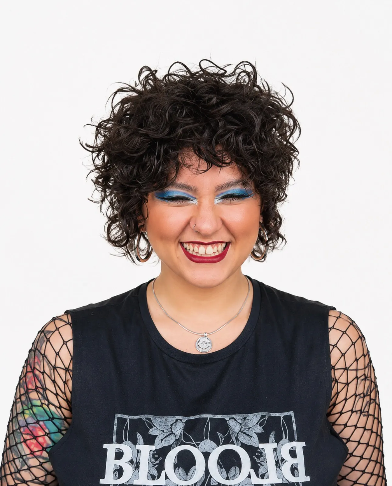 Textured curly bixie with layered ringlets and soft fringe