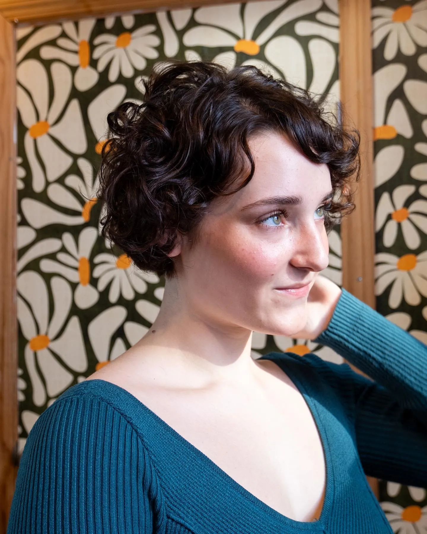 Soft curled bixie with loose waves and side-swept front