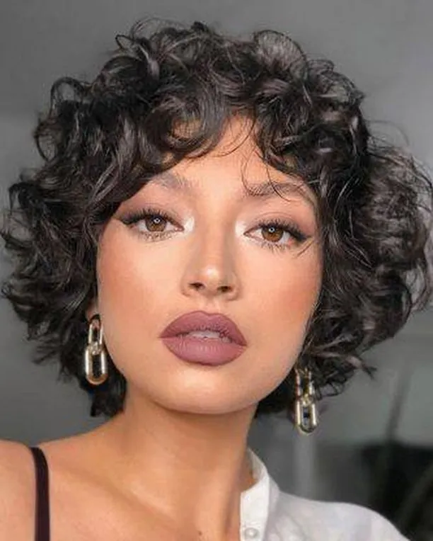 Full ringlet bixie with rounded shape and curly fringe