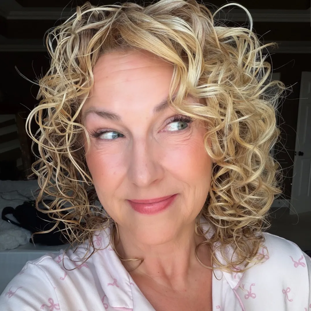 Blonde ringlet bob with a center part
