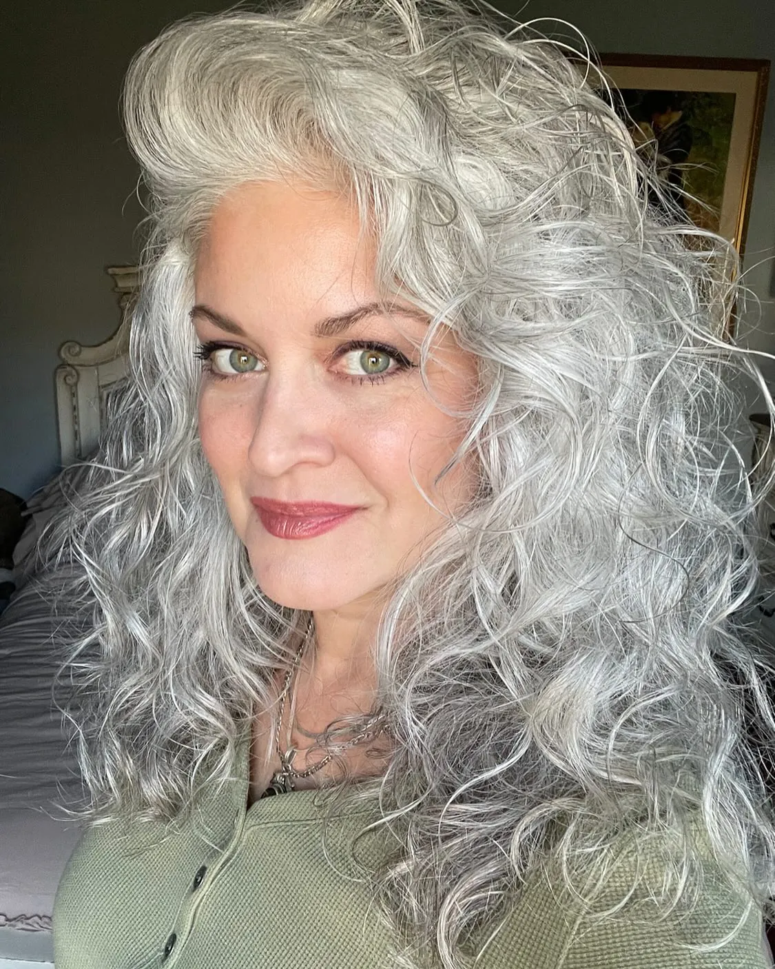 Long silver curls with side-swept volume