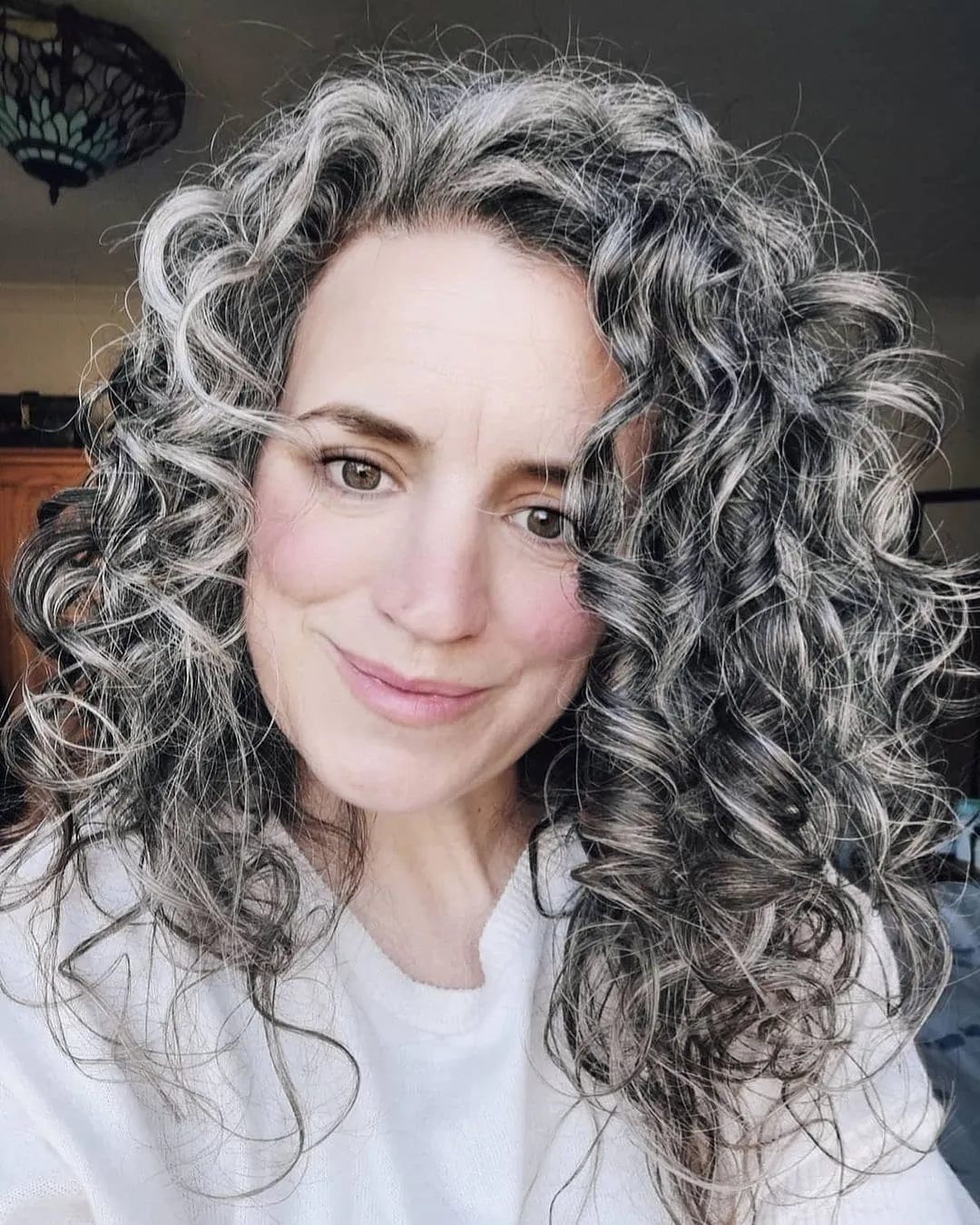 Long silver hair with defined spiral ringlets