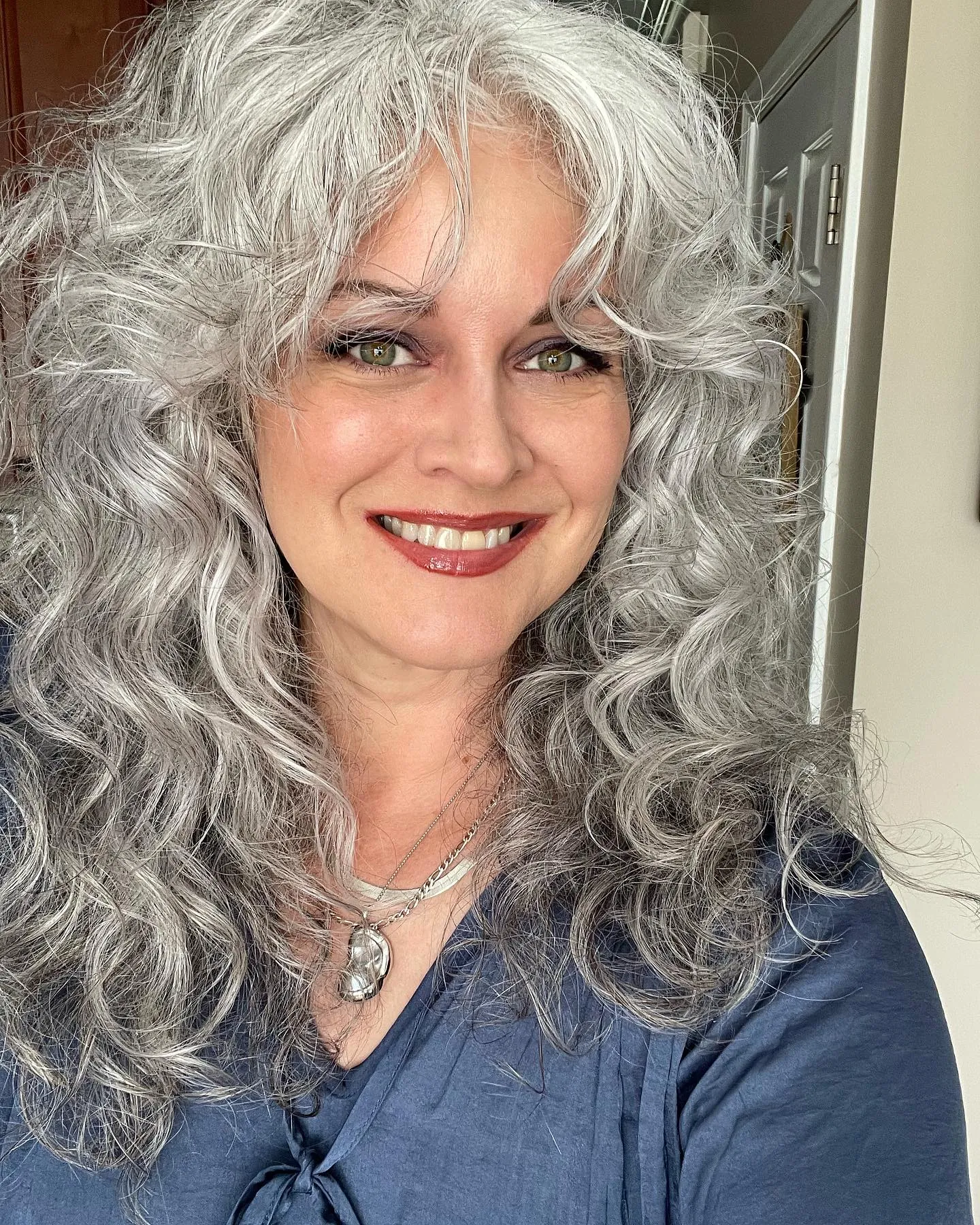Long silver layered curls with soft fringe pieces