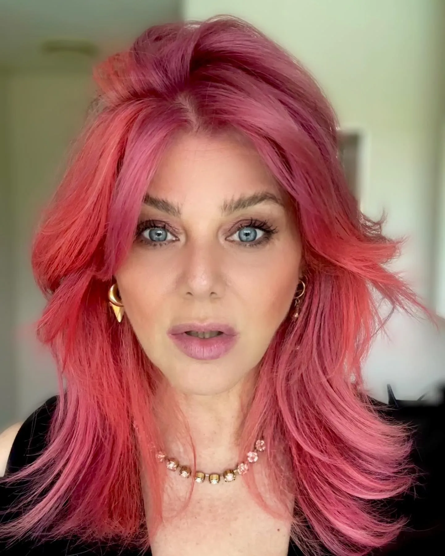 Pink curve cut with flipped shoulder-length layers