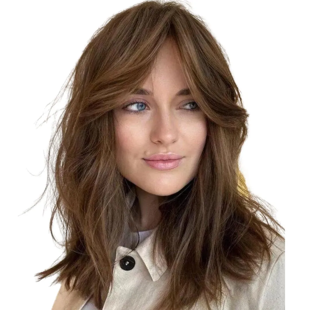 Medium brown curve cut with feathered layers and curtain fringe
