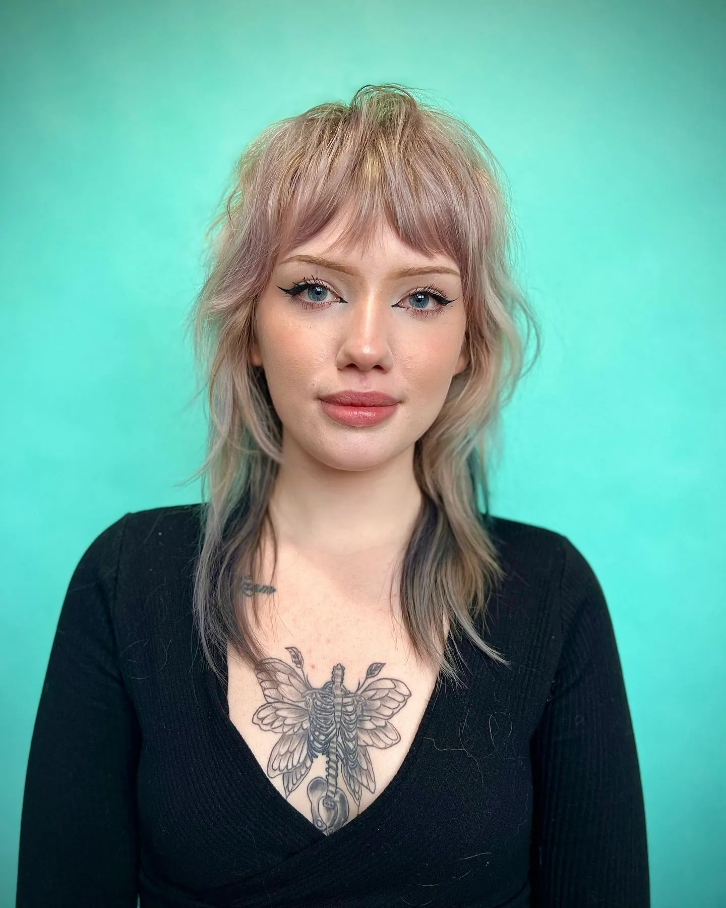 Soft layered wolf cut with light fringe