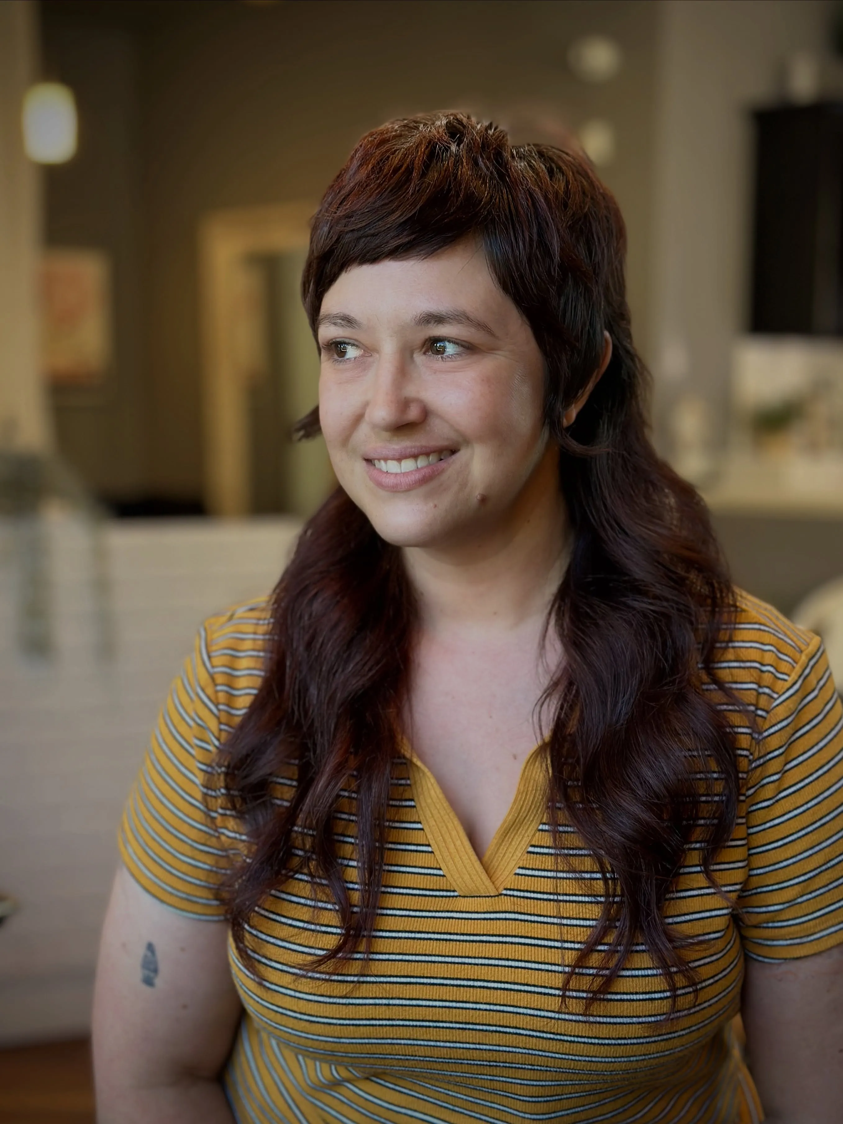 Long brunette mullet with soft rounded fringe