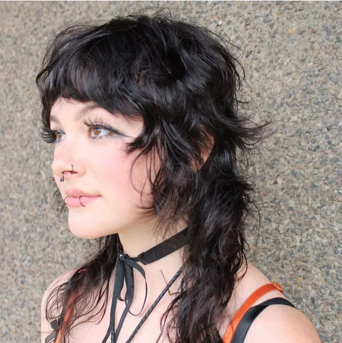 Curly dark mullet with short fringe and longer back