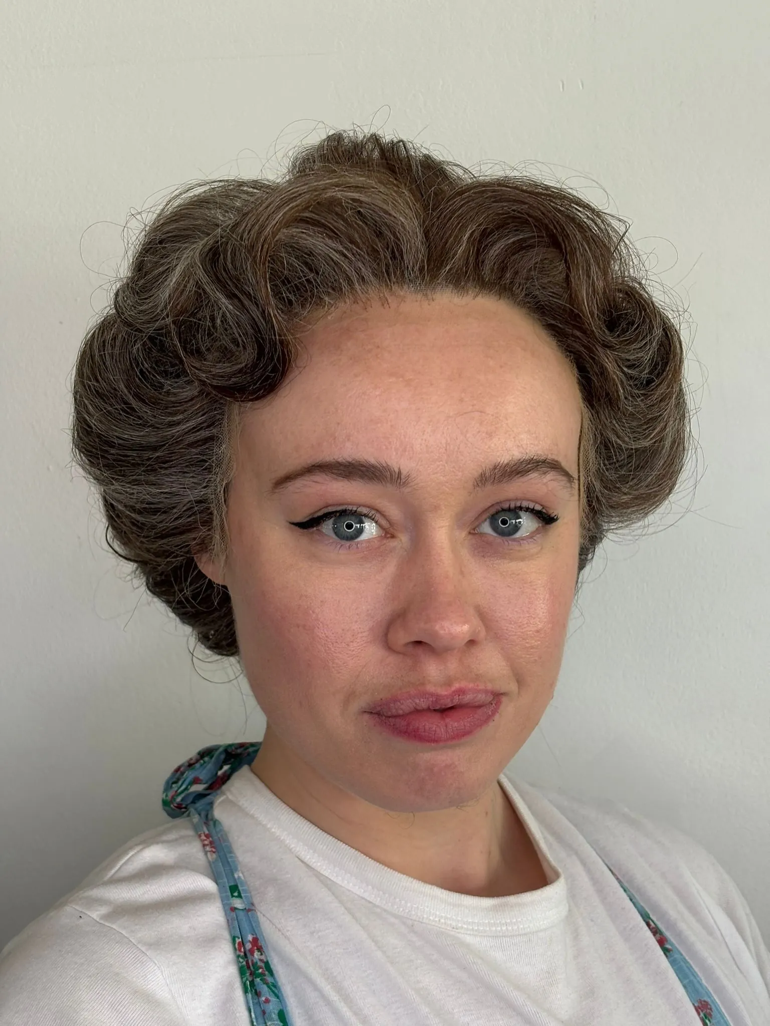 rolled side coils Edwardian-inspired hairstyle