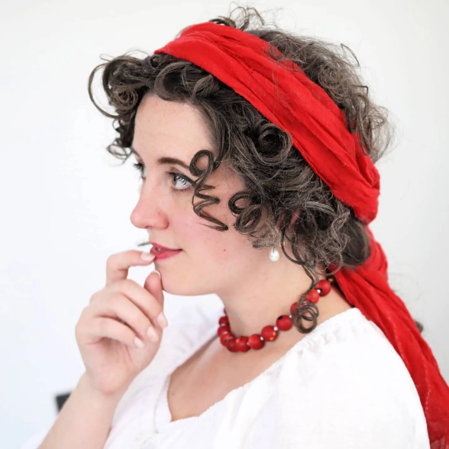 scarf-wrapped curls Edwardian-inspired hairstyle