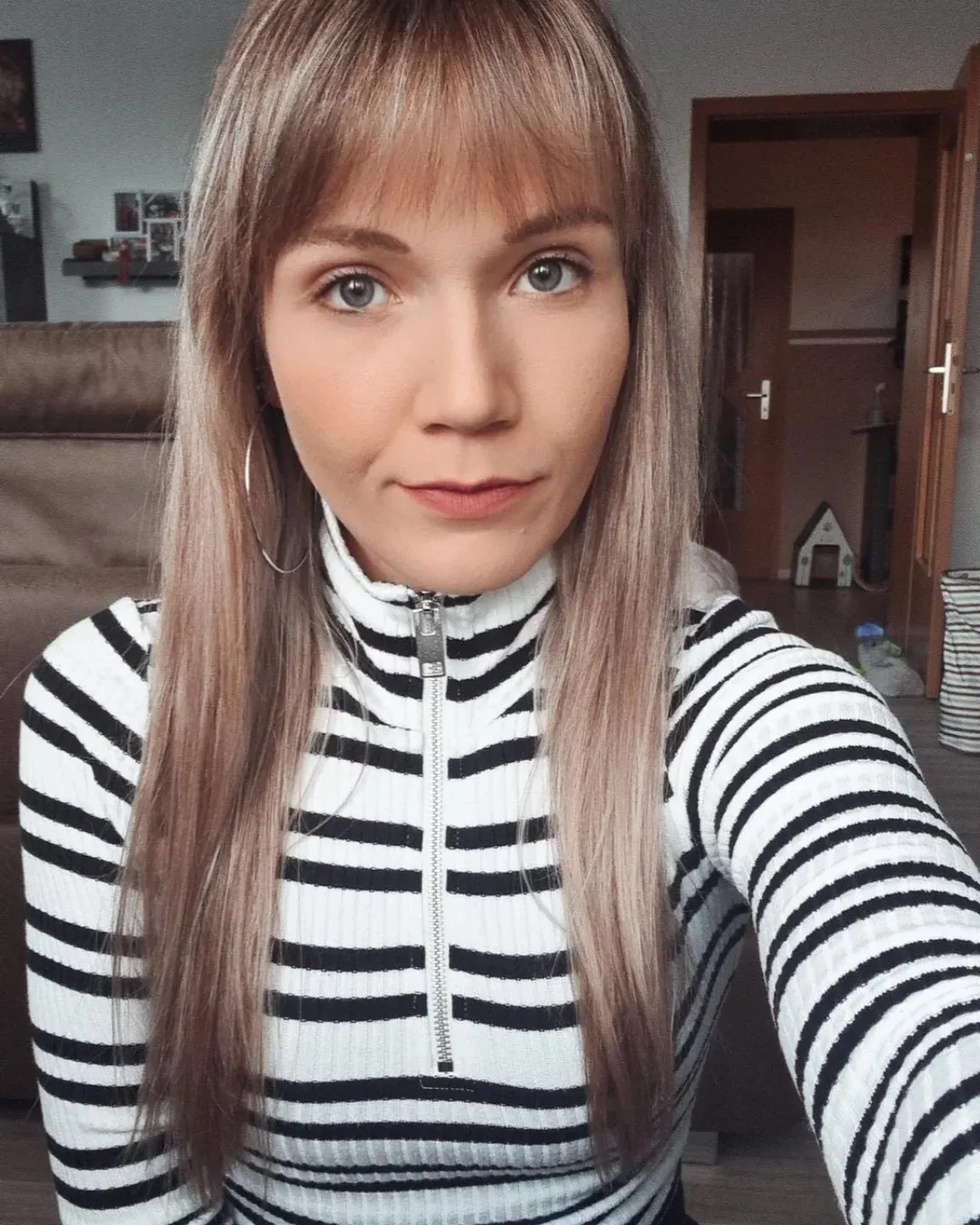Long light brown straight hair with soft full bangs