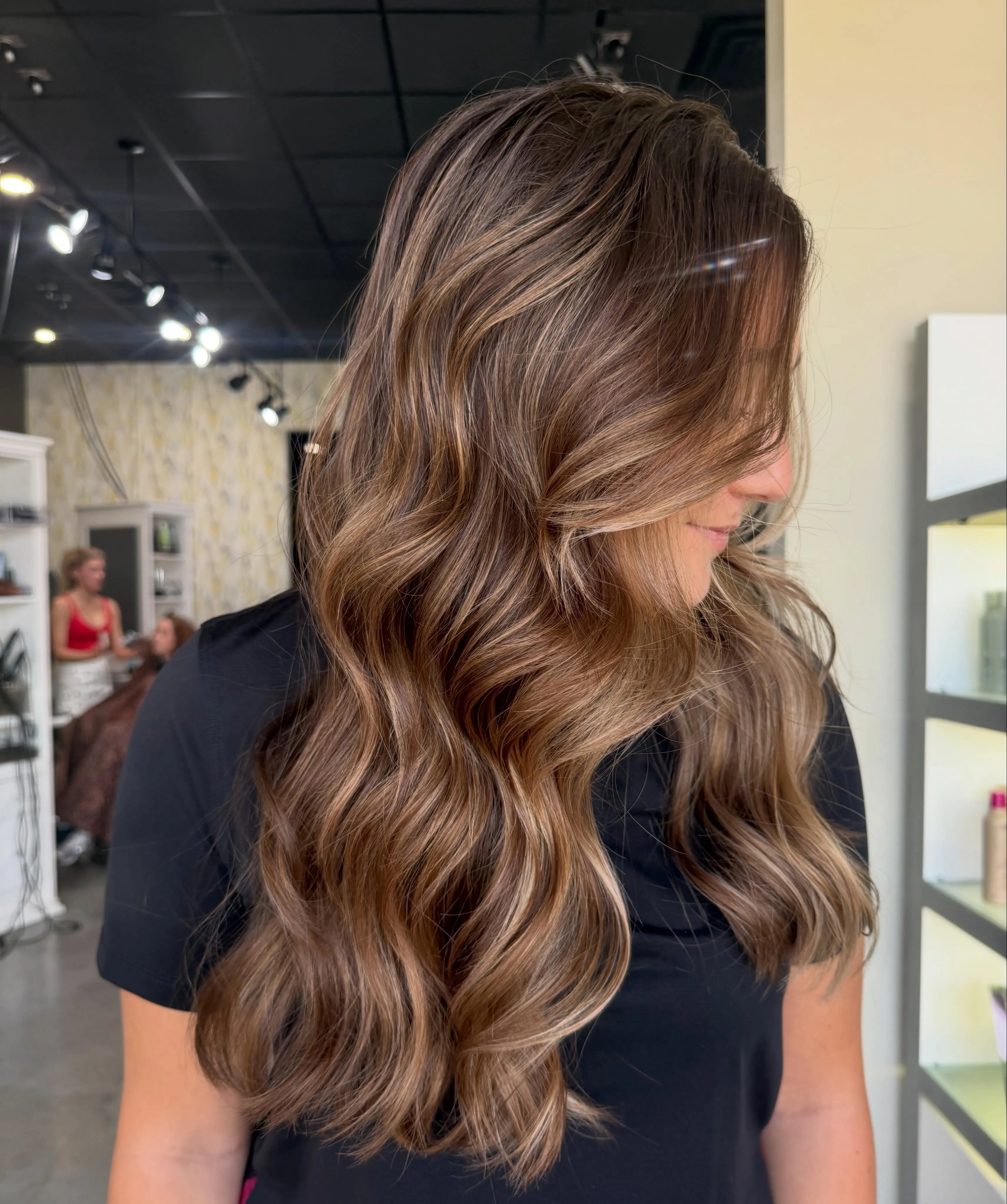 Long dimensional brunette waves with soft side part