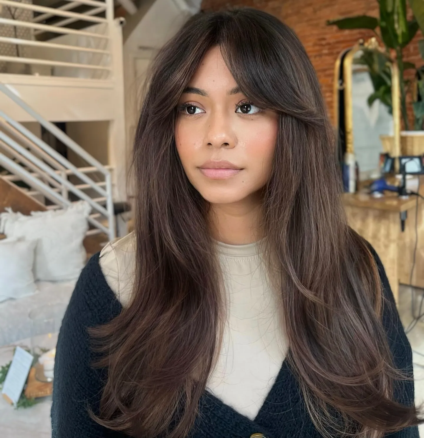 Long brunette curtain layers with smooth blowout shape