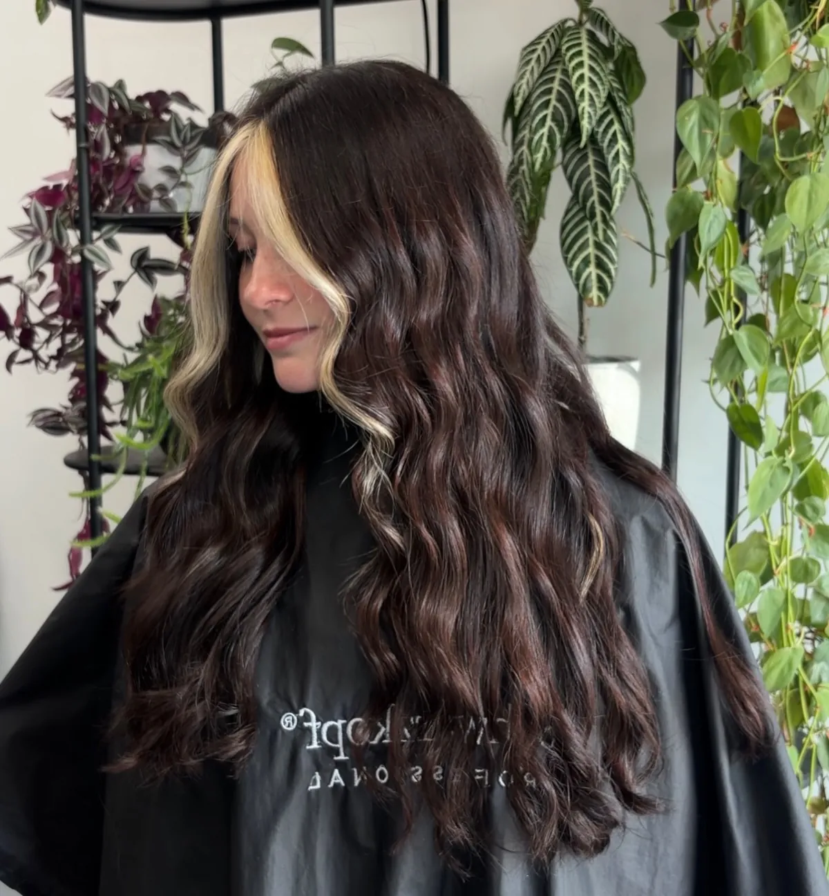 Long dark waves with bright blonde face-framing highlights